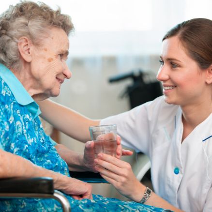 An old woman living in England receiving live-in care services from Biston Healthcare